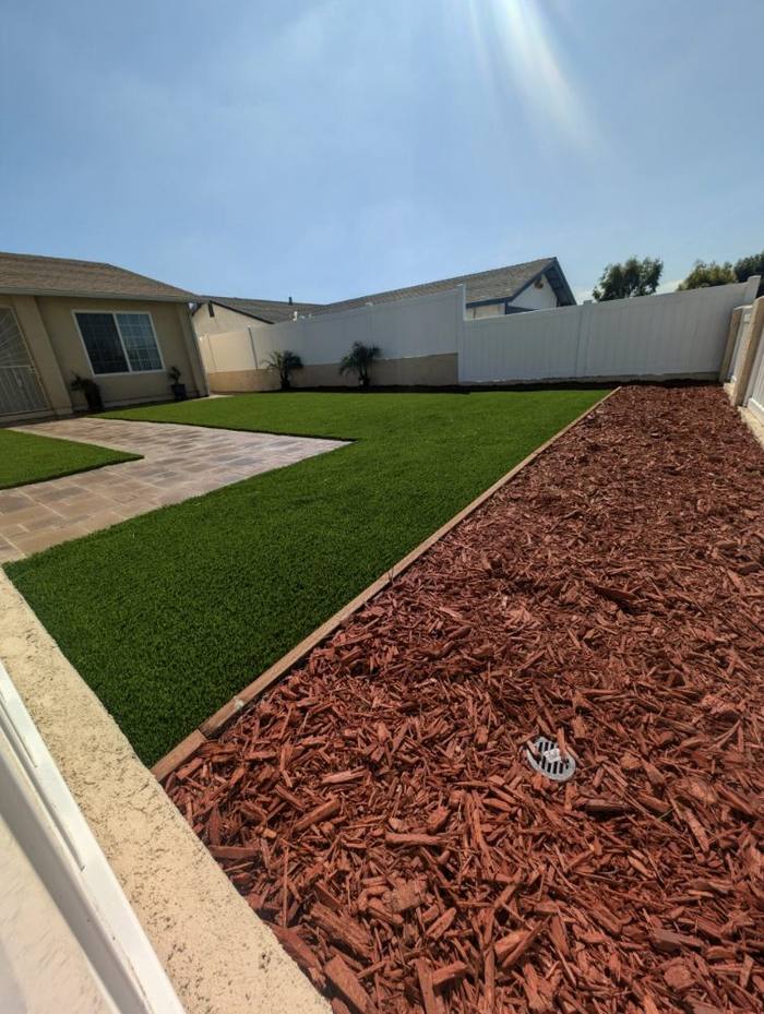 Backyard with turf and mulch bed