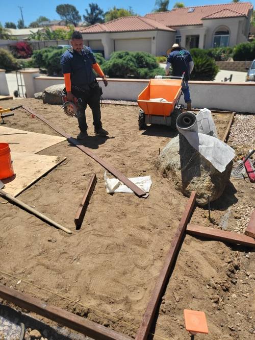 Crew member cutting on job site