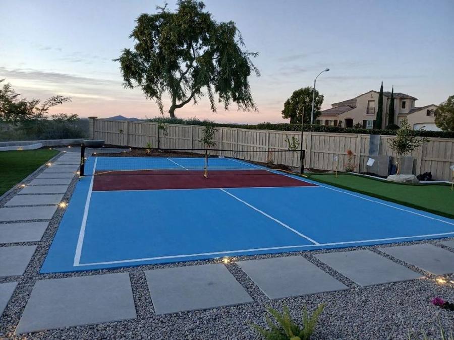Custom pickleball court with lighting and pavers