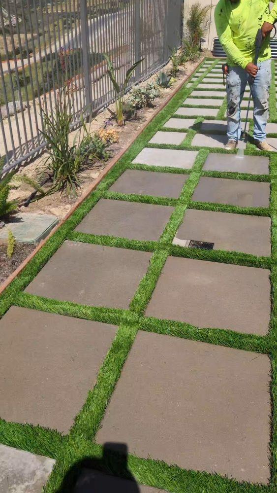 Paver grid with turf strips and landscaping