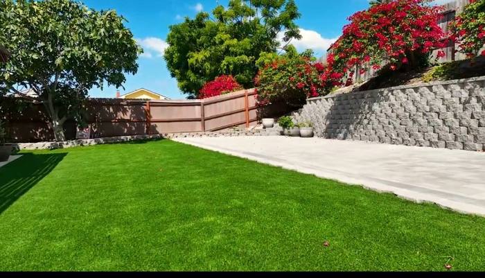 Retaining wall with turf lawn