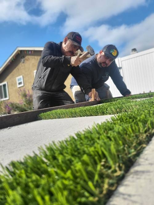 Torrescape crew installing turf edging