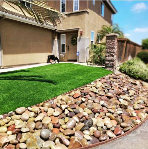Turf with river rock border